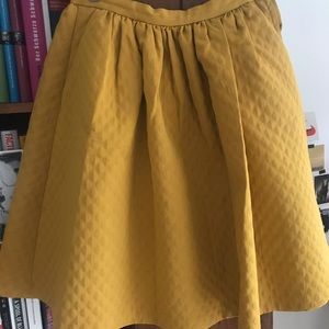 Mustard petticoat knee length skirt.